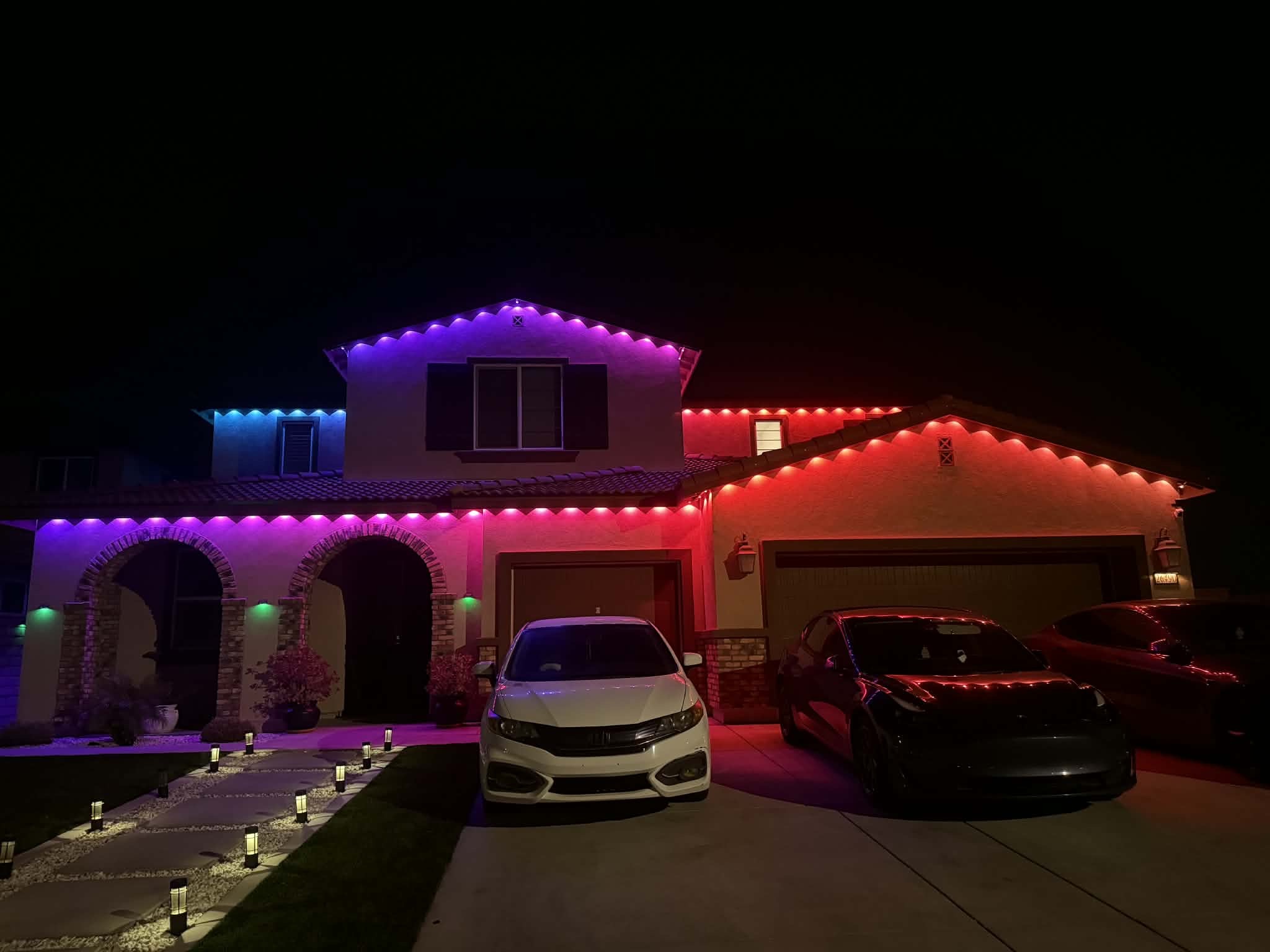 Multicolor permanent outdoor lights installed on a home